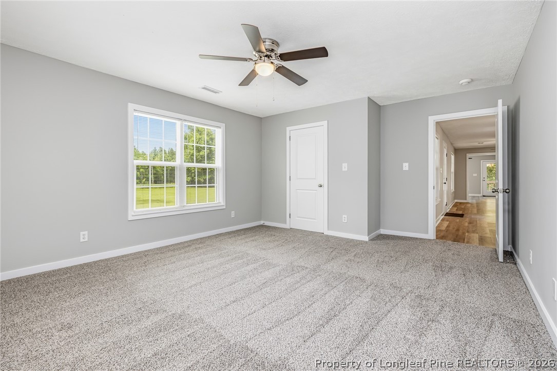 3524 Pine Log Road Lumberton, NC 28360 - Photo 16 of 42 an empty room with closet and windows