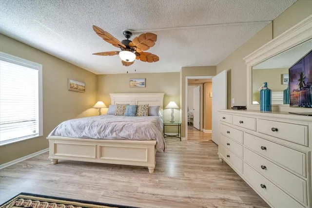 a spacious bedroom with a bed and a walk in closet