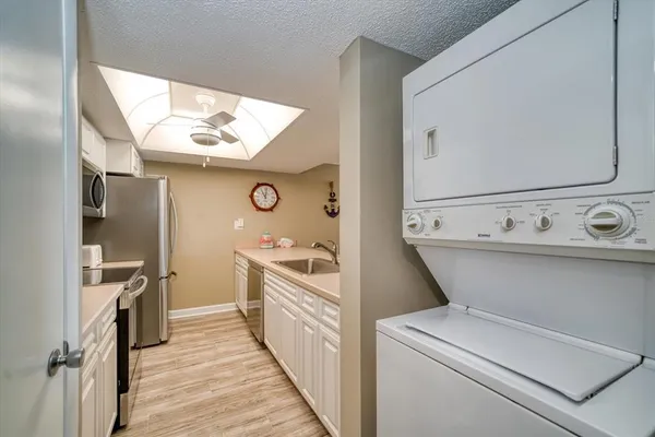 a bathroom with a toilet a sink and bathtub
