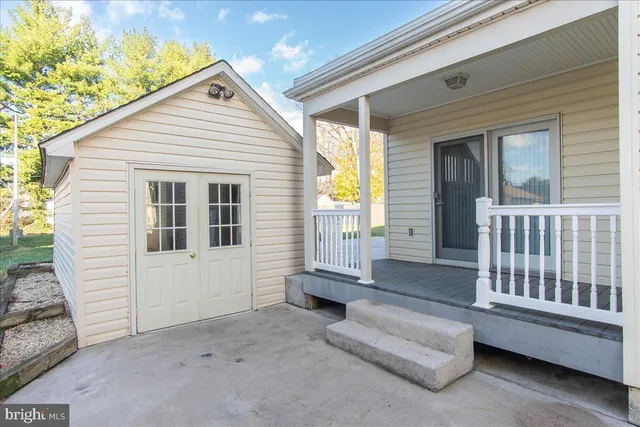 a view of front door with outdoor seating