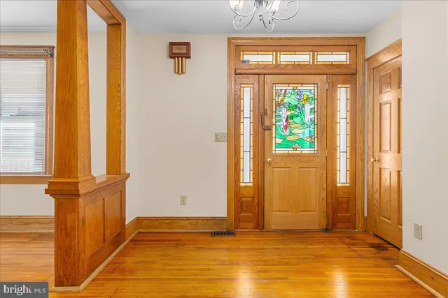 a view of front door with wooden floor