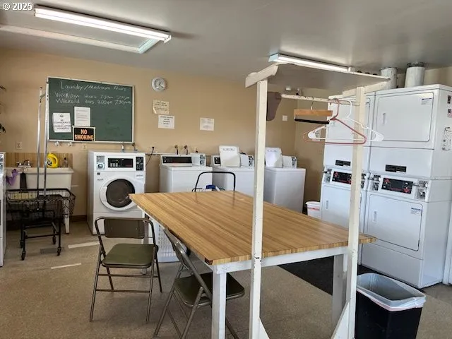 a view of a dining room with furniture and a fireplace