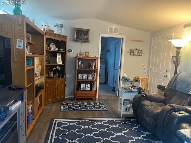 a living room with furniture and a rug