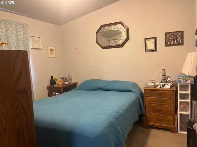 a bedroom with a bed and cabinets