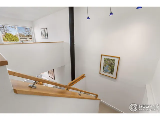 a bedroom with a large bed and a flat screen tv