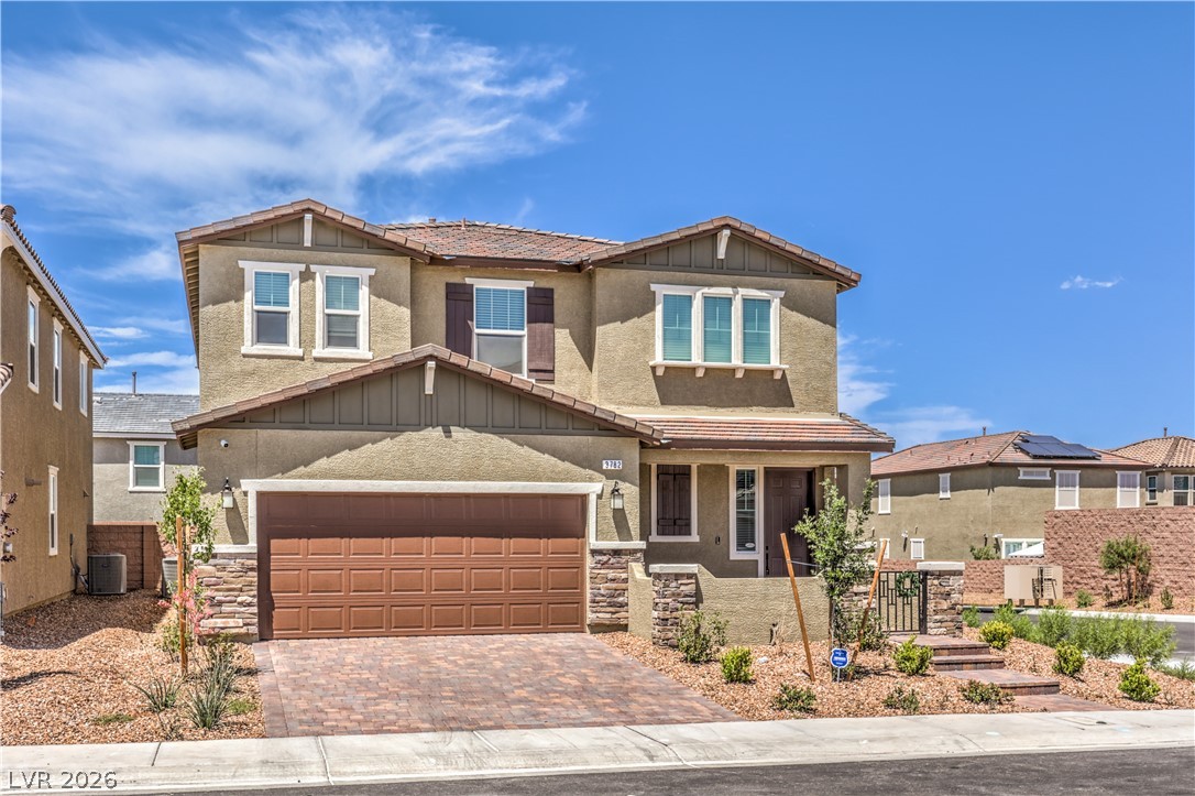 3782 Alla Rocca Avenue Henderson, NV 89044 - Photo 3 of 55 This two-story residence features a charming exterior with stone accents and an attached garage.