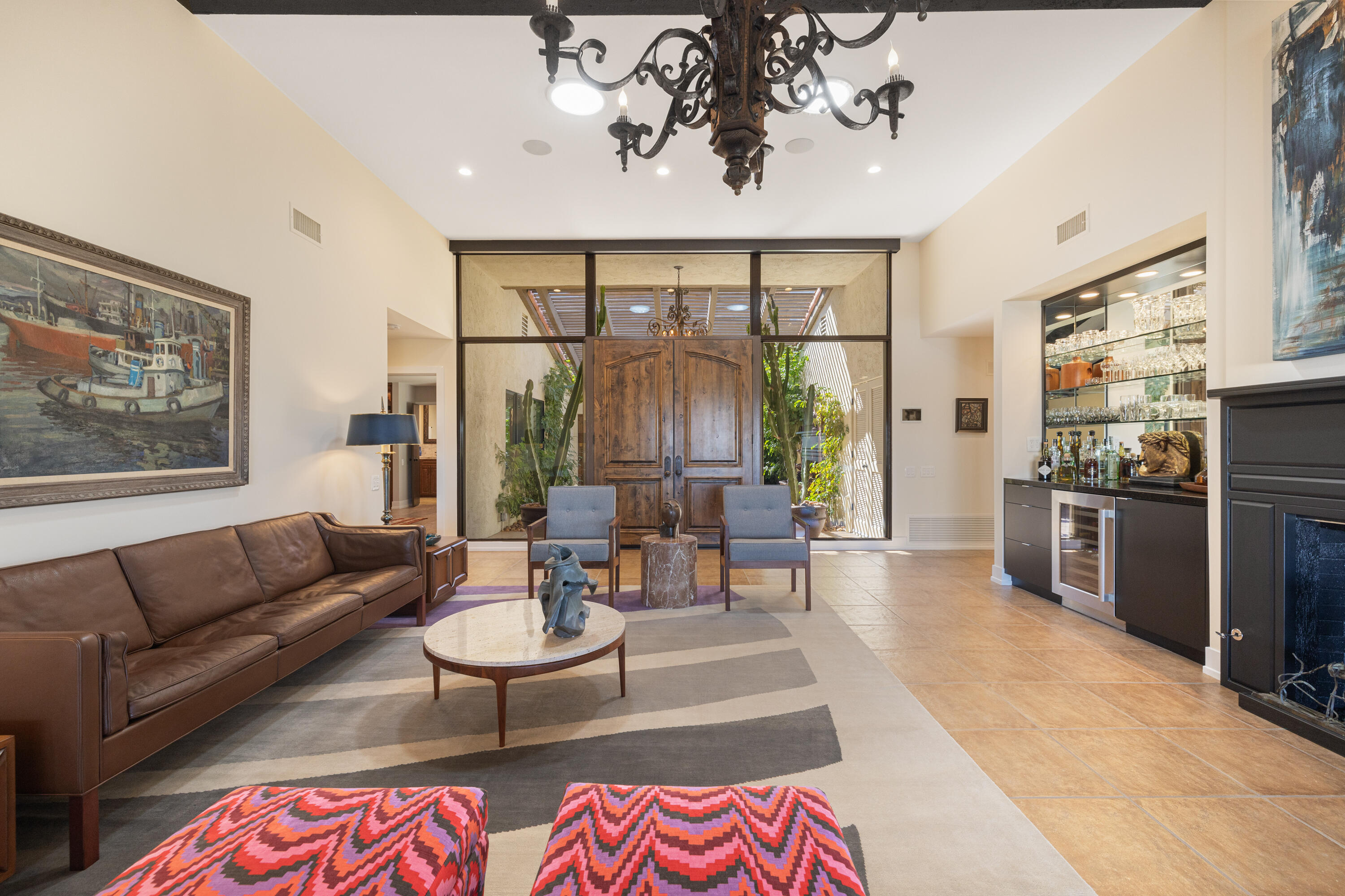 40170 Paseo Lindo Rancho Mirage, CA 92270 - Photo 14 of 51 a living room with furniture fireplace and a large window