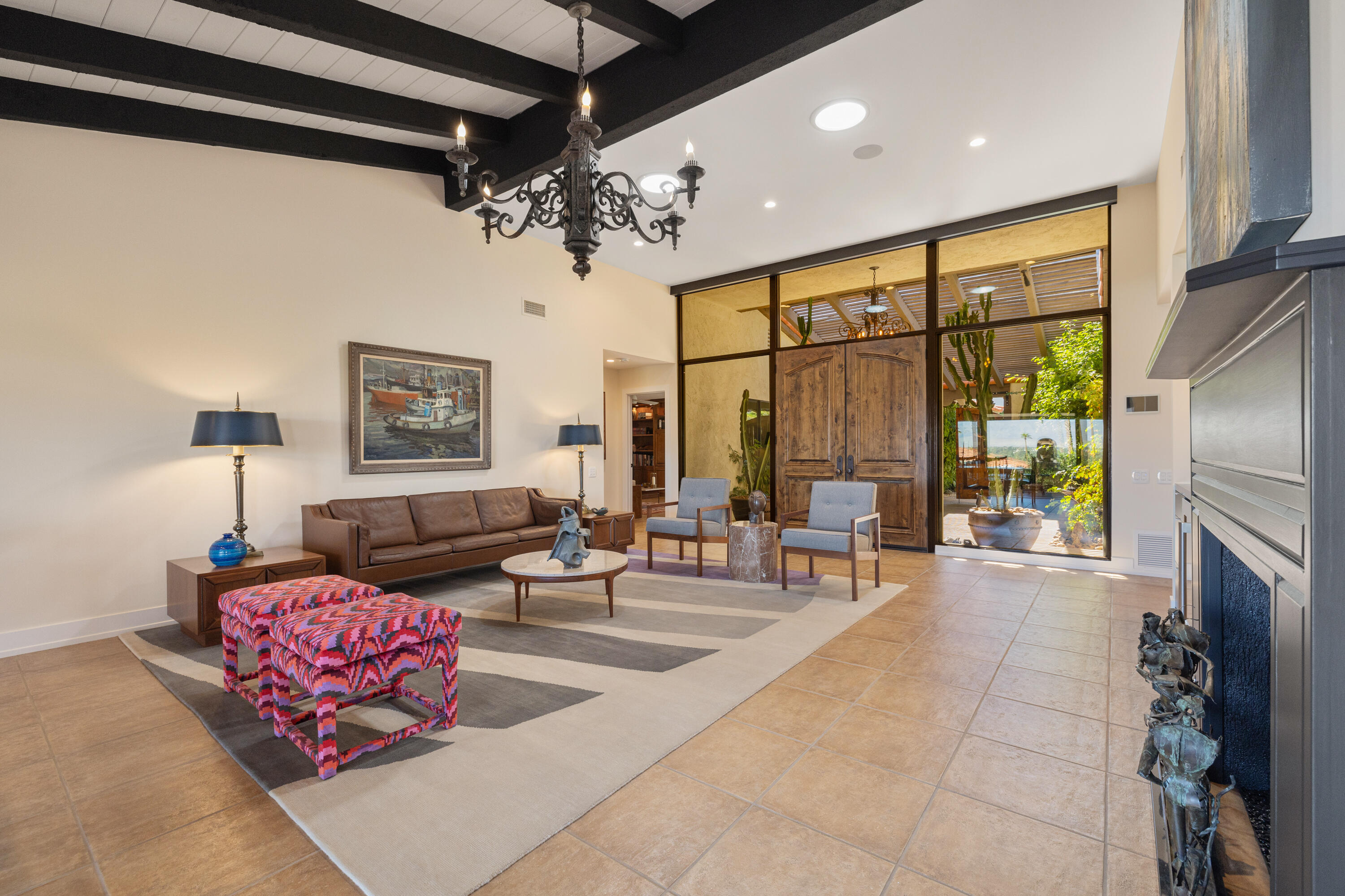 40170 Paseo Lindo Rancho Mirage, CA 92270 - Photo 15 of 51 a living room with fireplace furniture and a flat screen tv