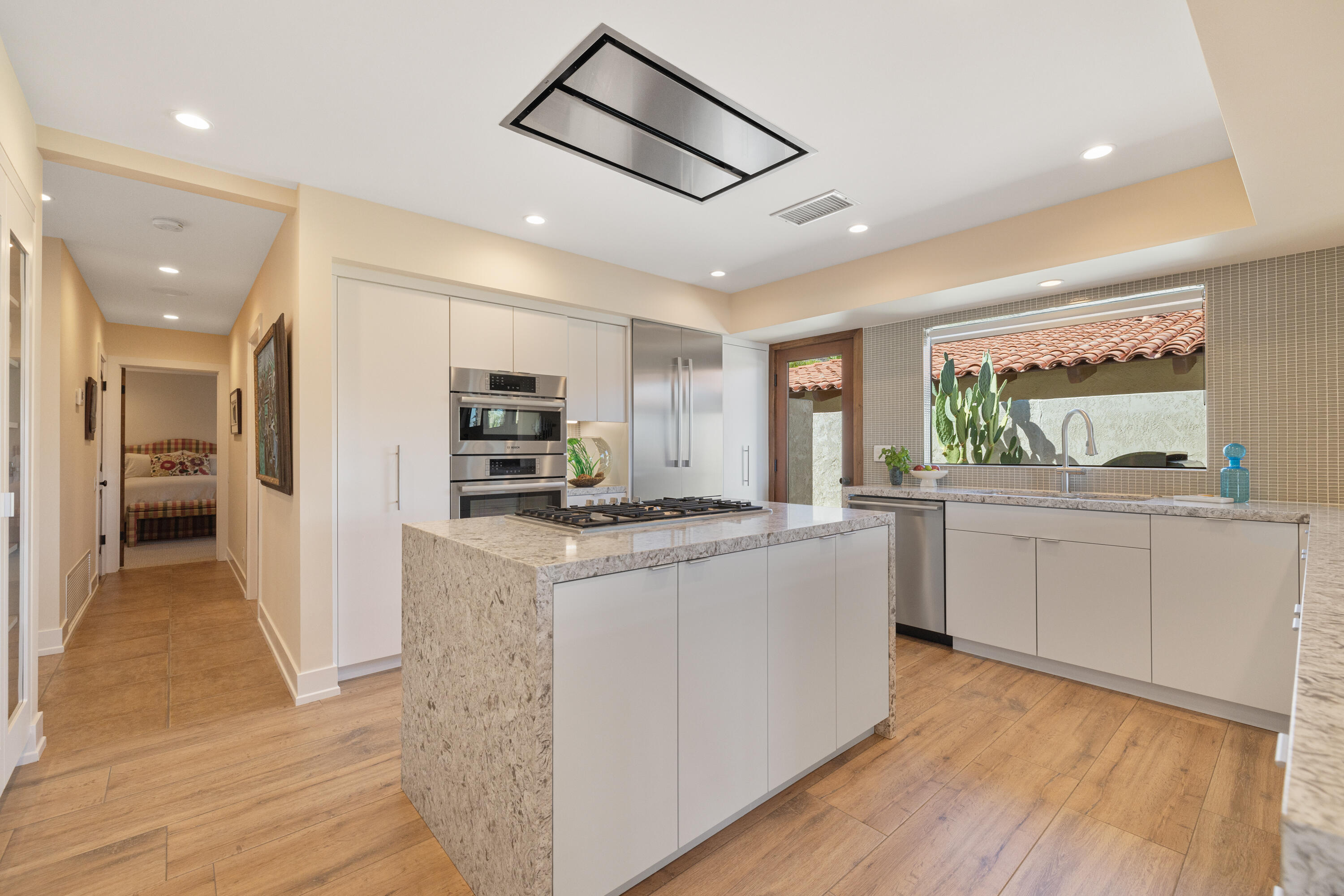 40170 Paseo Lindo Rancho Mirage, CA 92270 - Photo 23 of 51 a kitchen with stainless steel appliances granite countertop a stove and a refrigerator
