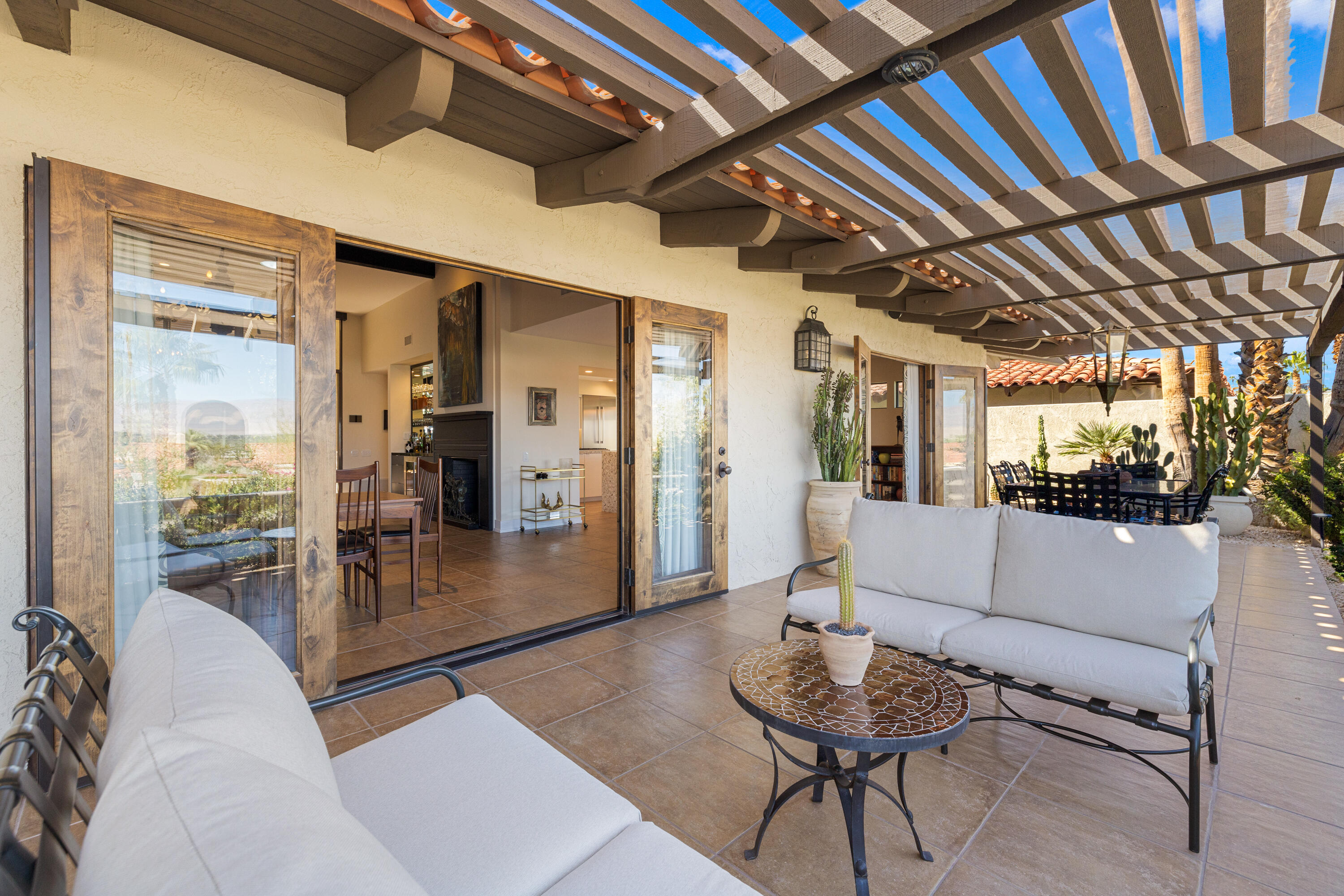 40170 Paseo Lindo Rancho Mirage, CA 92270 - Photo 29 of 51 a living room with furniture and a chandelier
