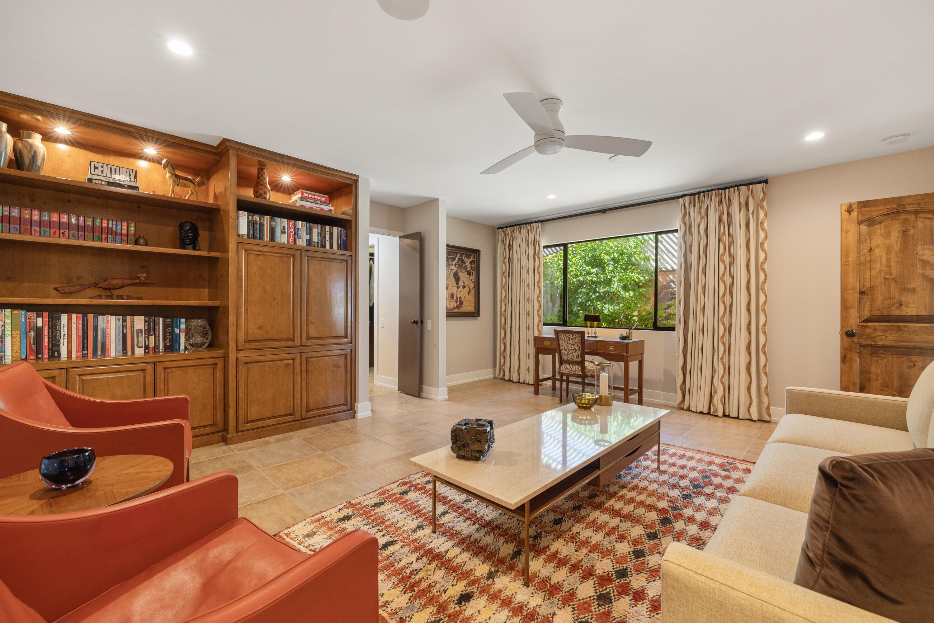 40170 Paseo Lindo Rancho Mirage, CA 92270 - Photo 39 of 51 a living room with furniture and a floor to ceiling window