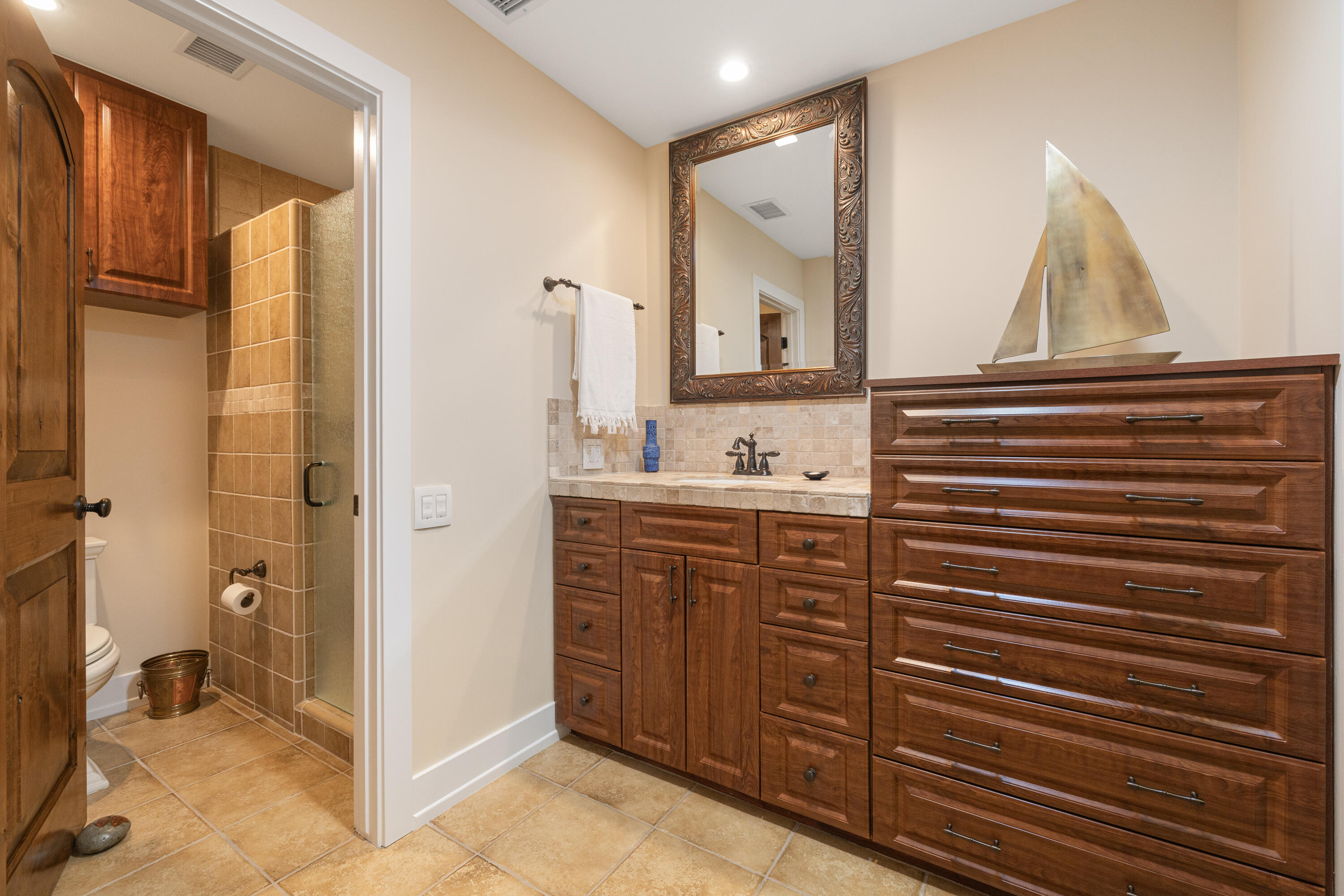 40170 Paseo Lindo Rancho Mirage, CA 92270 - Photo 41 of 51 a bathroom with a sink and a mirror