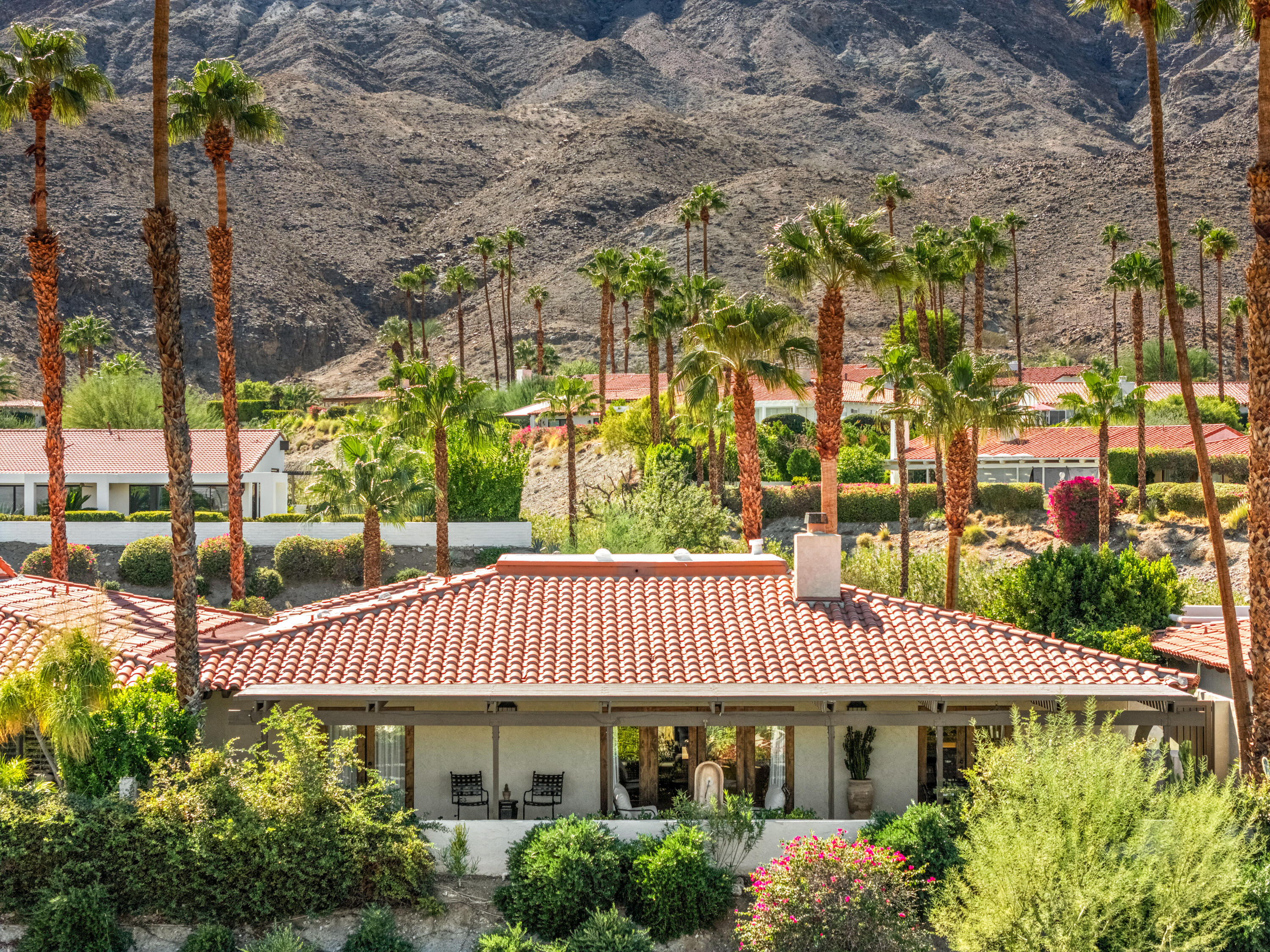 40170 Paseo Lindo Rancho Mirage, CA 92270 - Photo 46 of 51 a view of a patio with table and chairs and potted plants