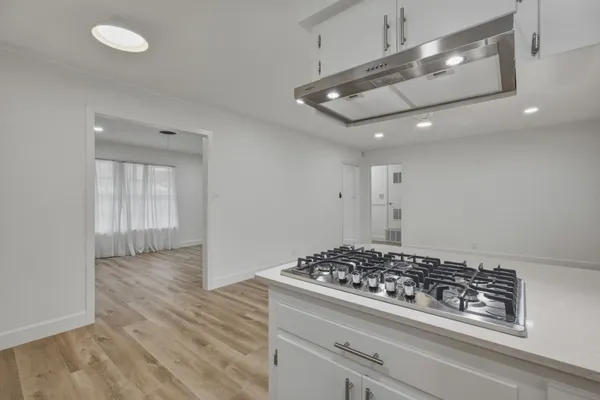a kitchen with an oven and cabinets