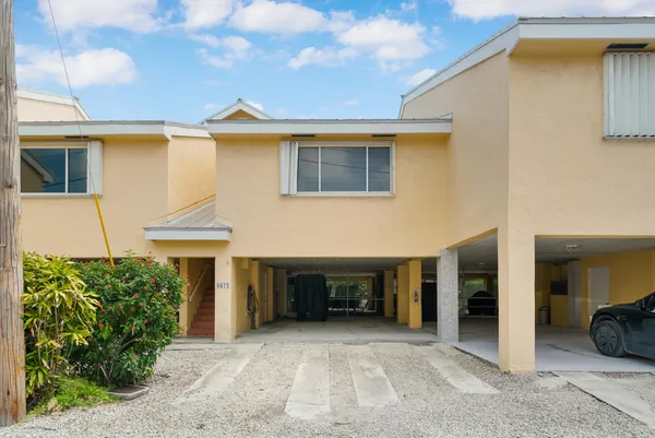a front view of a house with yard