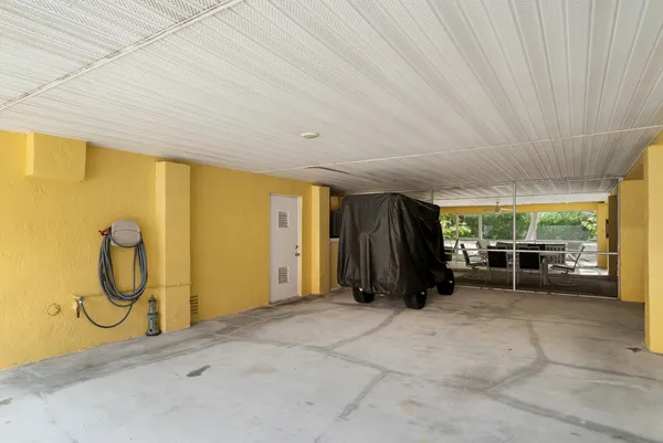 a bedroom with a bed and a tv