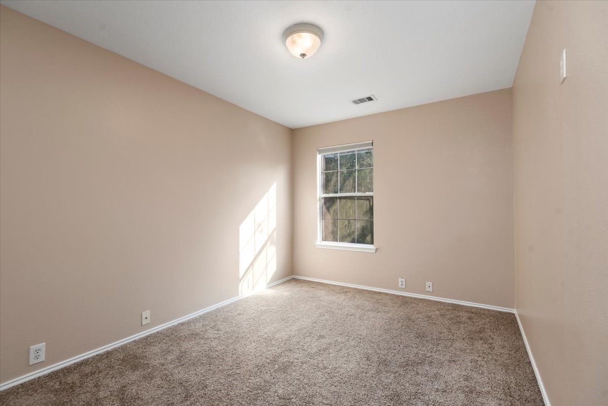 23611 Youpon Lake Lane Spring, TX 77373 - Photo 18 of 25 an empty room with windows