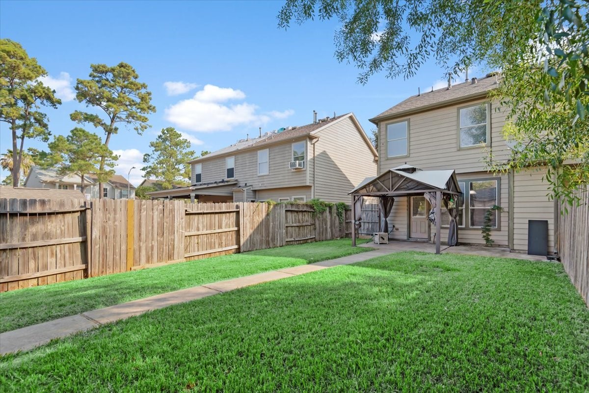 23611 Youpon Lake Lane Spring, TX 77373 - Photo 23 of 25 a view of a house with a yard and sitting area