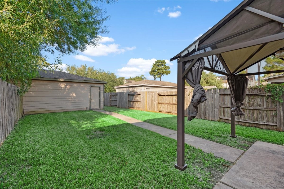 23611 Youpon Lake Lane Spring, TX 77373 - Photo 24 of 25 a view of a backyard with a garden
