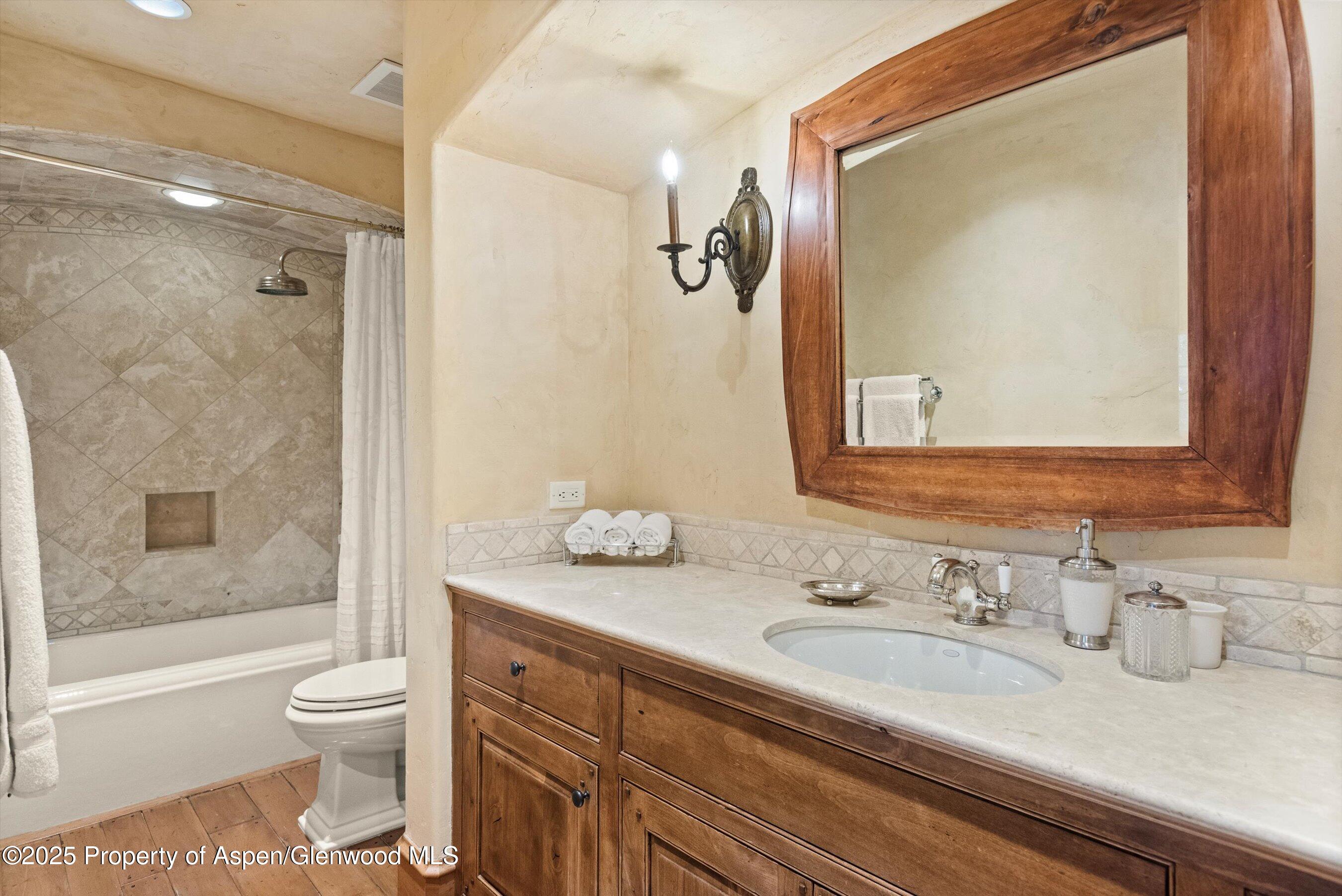 Aspen Central Core Aspen, CO 81611 - Photo 13 of 26 a bathroom with a granite countertop sink toilet and shower