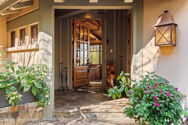 a view of a house with a flower garden