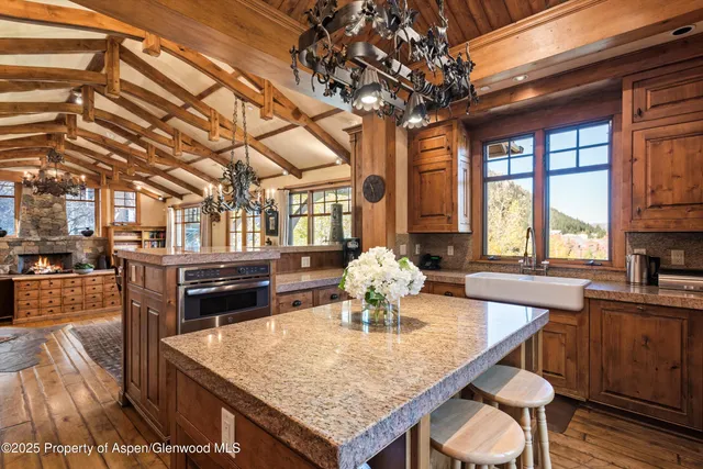 a dining table with chairs and window