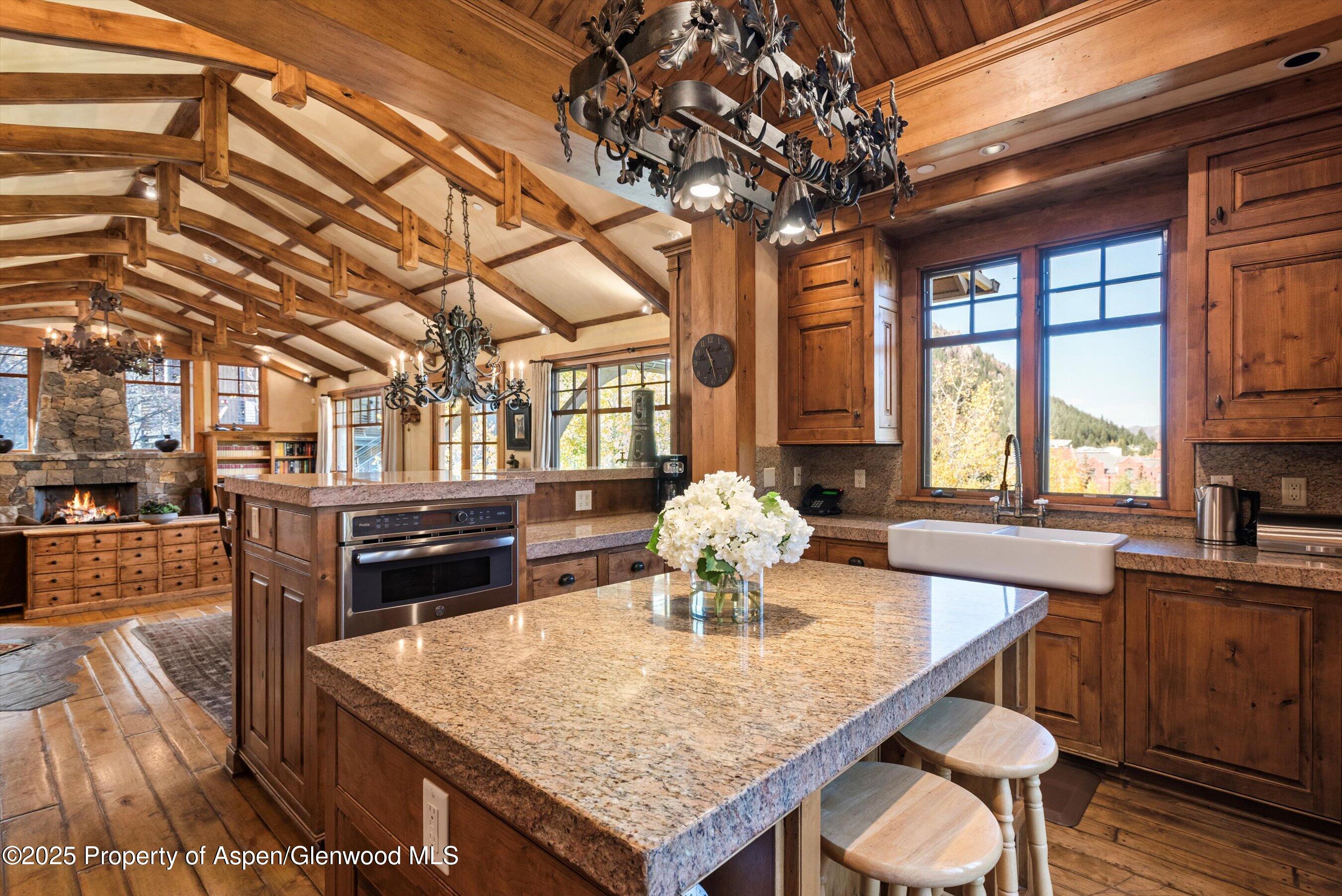 Aspen Central Core Aspen, CO 81611 - Photo 6 of 26 a dining table with chairs and window