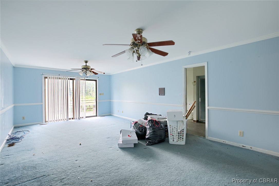 2488 Winfred Road Hayes, VA 23072 - Photo 22 of 25 Carpeted spare room featuring ceiling fan and ornamental molding