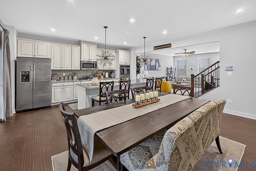 17976 Spotted Oak Road Dumfries, VA 22026 - Photo 14 of 52 Open-concept dining area featuring dark wood-finis