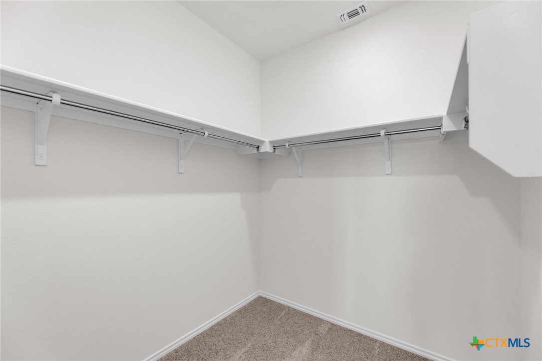 703 Ryan Street Belton, TX 76513 - Photo 23 of 44 a view of an empty walk in closet