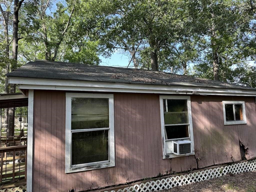 110 Stewart Street Coldspring, TX 77331 - Photo 3 of 12 a backyard of a house with seating space
