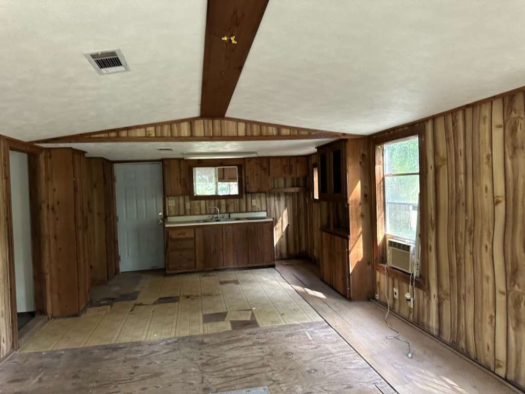 110 Stewart Street Coldspring, TX 77331 - Photo 4 of 12 a kitchen with stainless steel appliances granite countertop a refrigerator and a sink