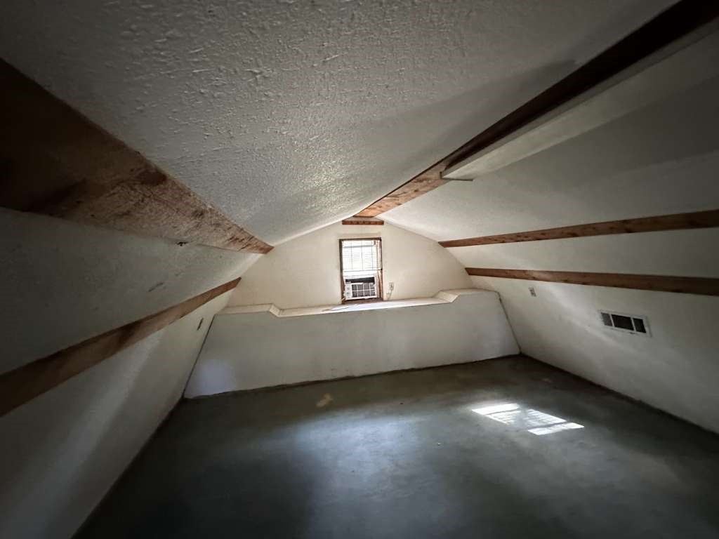 110 Stewart Street Coldspring, TX 77331 - Photo 9 of 12 a view of an empty room with windows