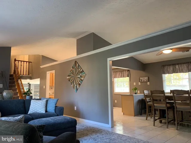 a livingroom with furniture and window