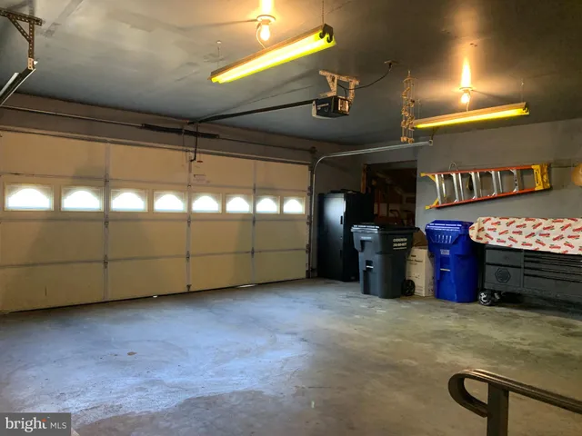 a view of an empty room with windows