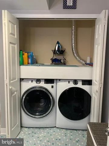 a utility room with dryer and washer