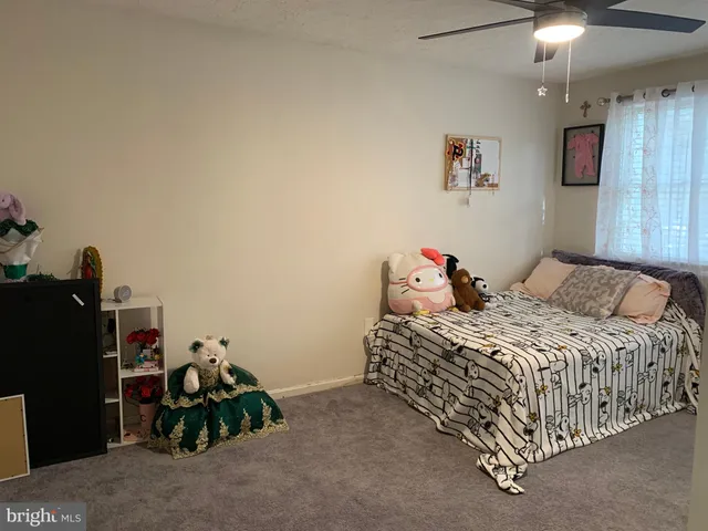 a bedroom with a bed and a tv