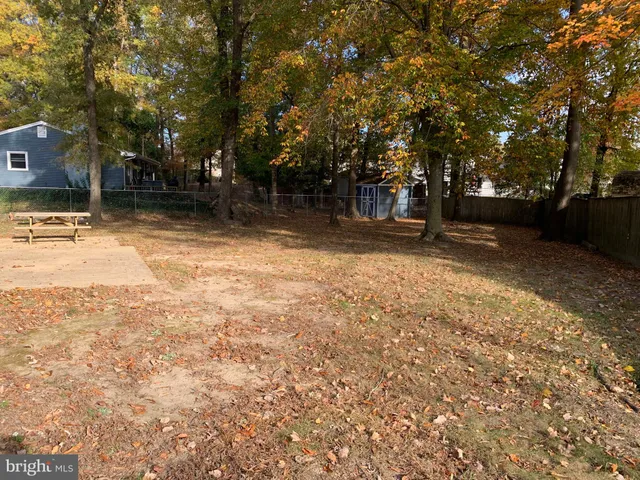 a backyard of a house with a parked tree