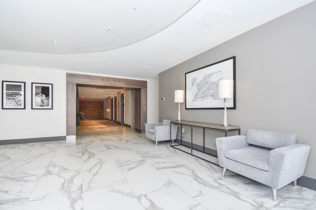 8-12 Museum Way, Unit 1224 Cambridge, MA 02141 - Photo 15 of 18 a living room with furniture and a window
