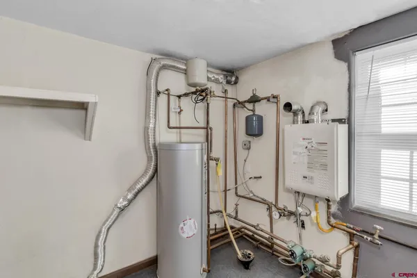 a view of a livingroom with furniture and windows