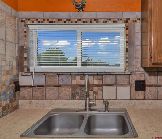 a kitchen with a sink and a window