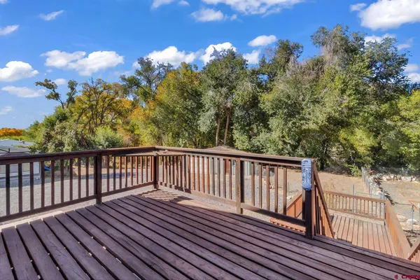 a view of balcony with wooden floor