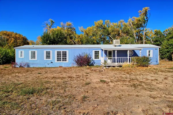 a view of a livingroom with furniture and window
