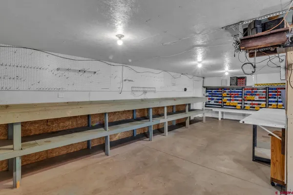 a view of an empty room with wooden walls