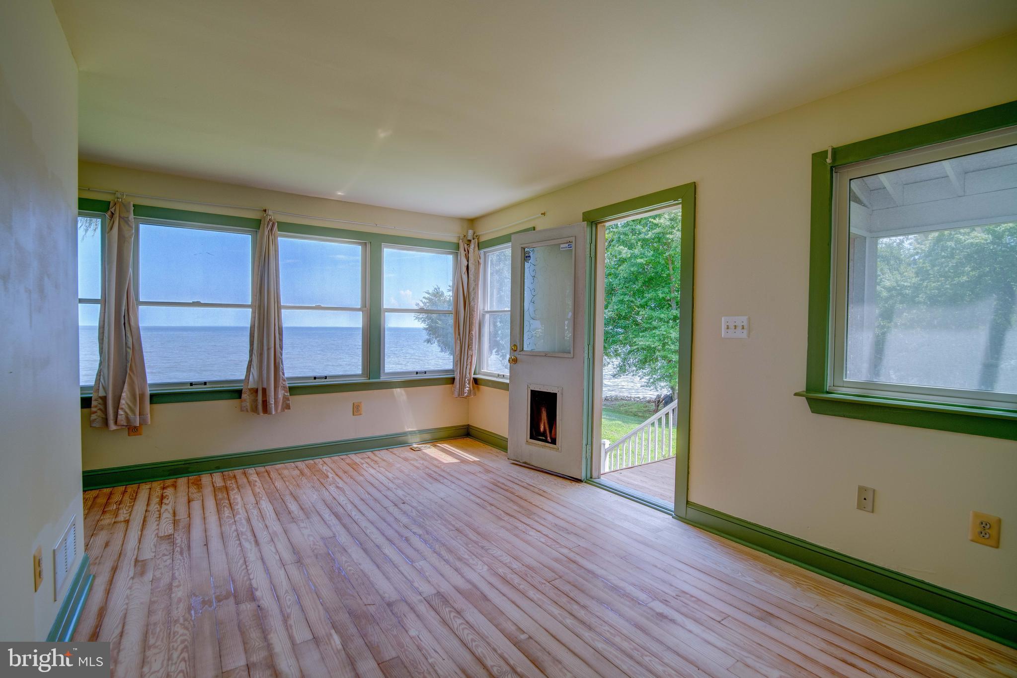 6353 Genoa Road Tracys Landing, MD 20779 - Photo 48 of 84 Main level bedroom with entrance to side porch
