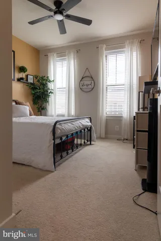 a bed room with a bed and a window