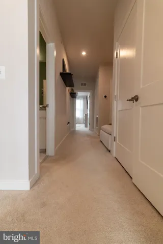 a view of a big room with closet and windows