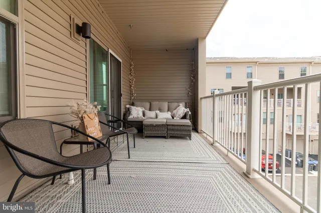 a view of a chairs and tables in the balcony