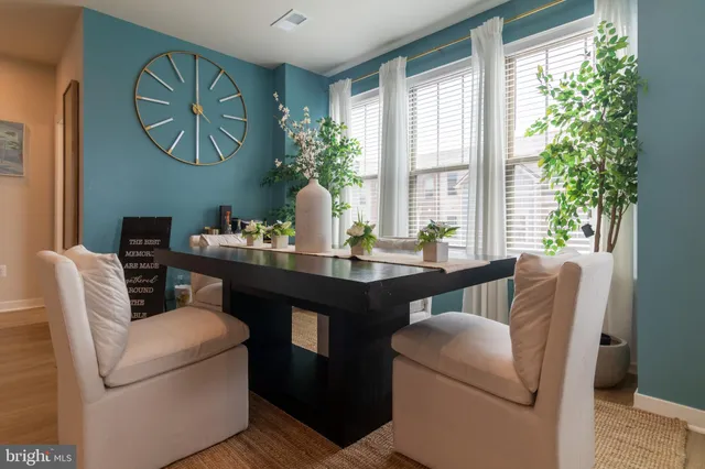 a view of a dining room with furniture window and outside view