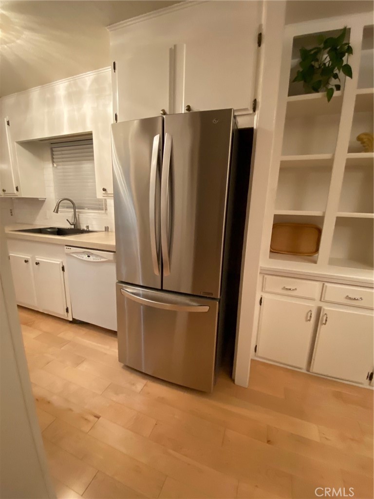 1595 Los Osos Valley Road, Unit 8A Los Osos, CA 93402 - Photo 11 of 73 a kitchen with stainless steel appliances a refrigerator sink and cabinets